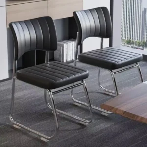 Black leather sled base chair with a metal frame in a modern conference room
