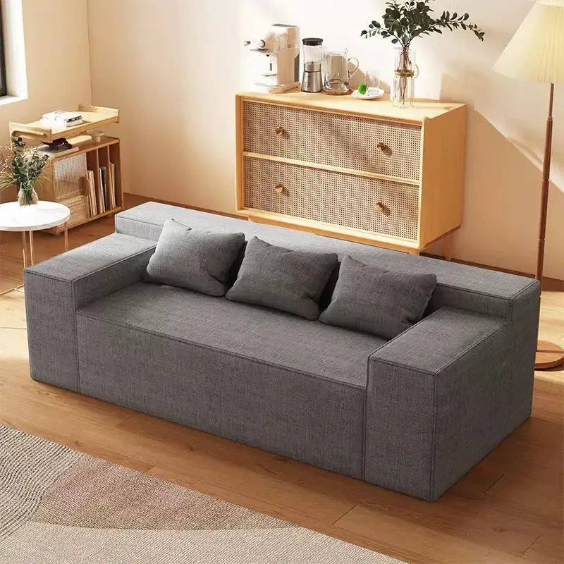 Light gray couch in a minimalist modern living room setting