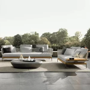 Premium teak outdoor sofa with grey waterproof cushions on a luxury villa patio