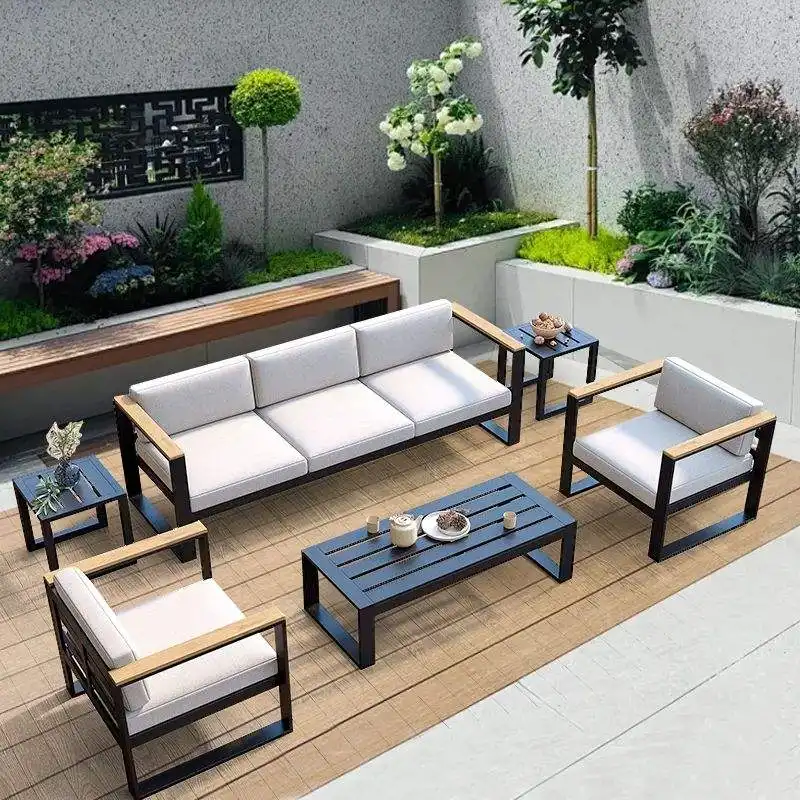 Durable metal patio furniture with comfortable grey cushions and coffee table