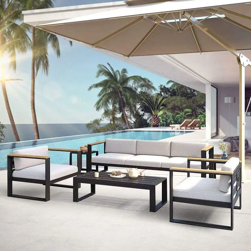 Modern high-class metal patio furniture set on a wooden outdoor deck