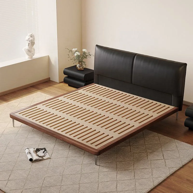 Modern mid century bed with black leather headboard and wooden platform